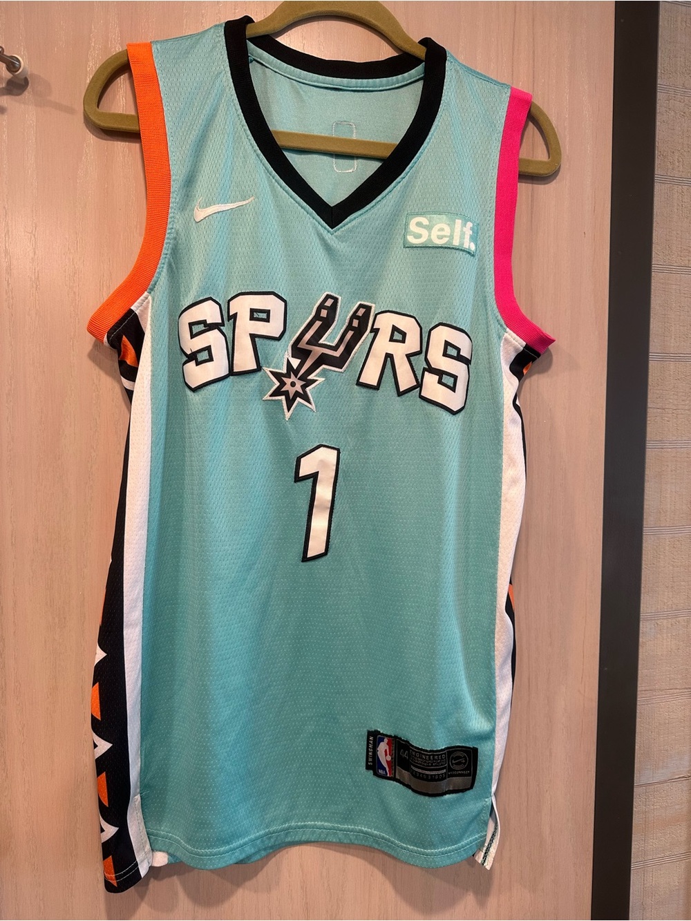 Wembanyama Nike Spurs Jersey - Aqua with Pink & Orange Accents. Official NBA